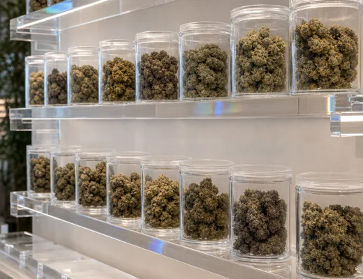 Acrylic pedestal and riser merchandising for pre-rolls and edibles in a dispensary