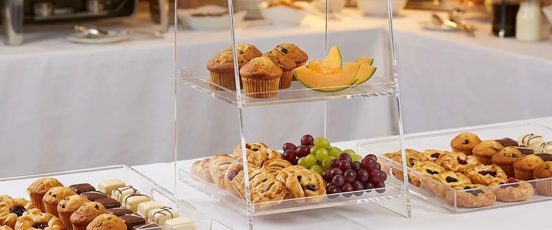 Bakery counter with acrylic display cases and pastry risers