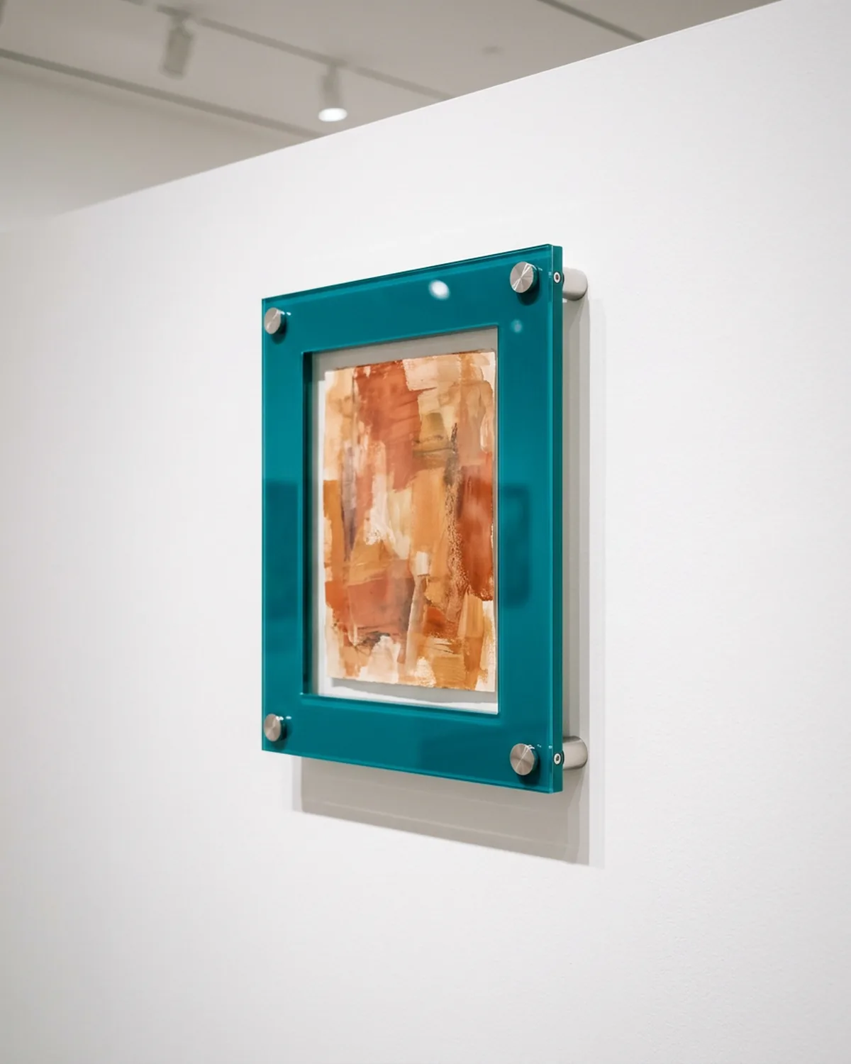 420 colored acrylic floating gallery frames with standoff mounts installed across a contemporary art gallery network