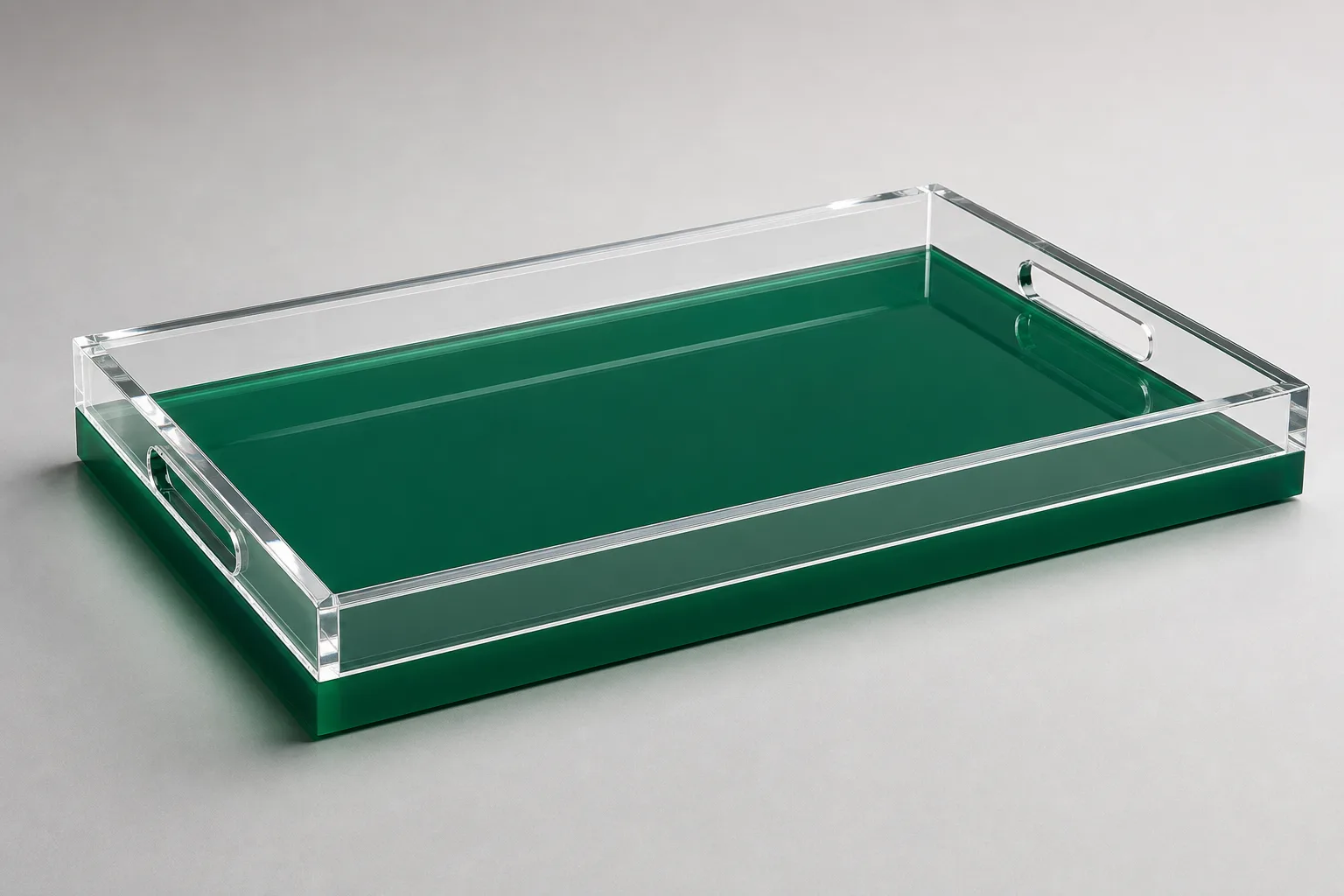 Two-tone acrylic serving tray with a deep green base layer laminated under a clear cast PMMA top, polished edge showing the clean horizontal bond line between the two colors