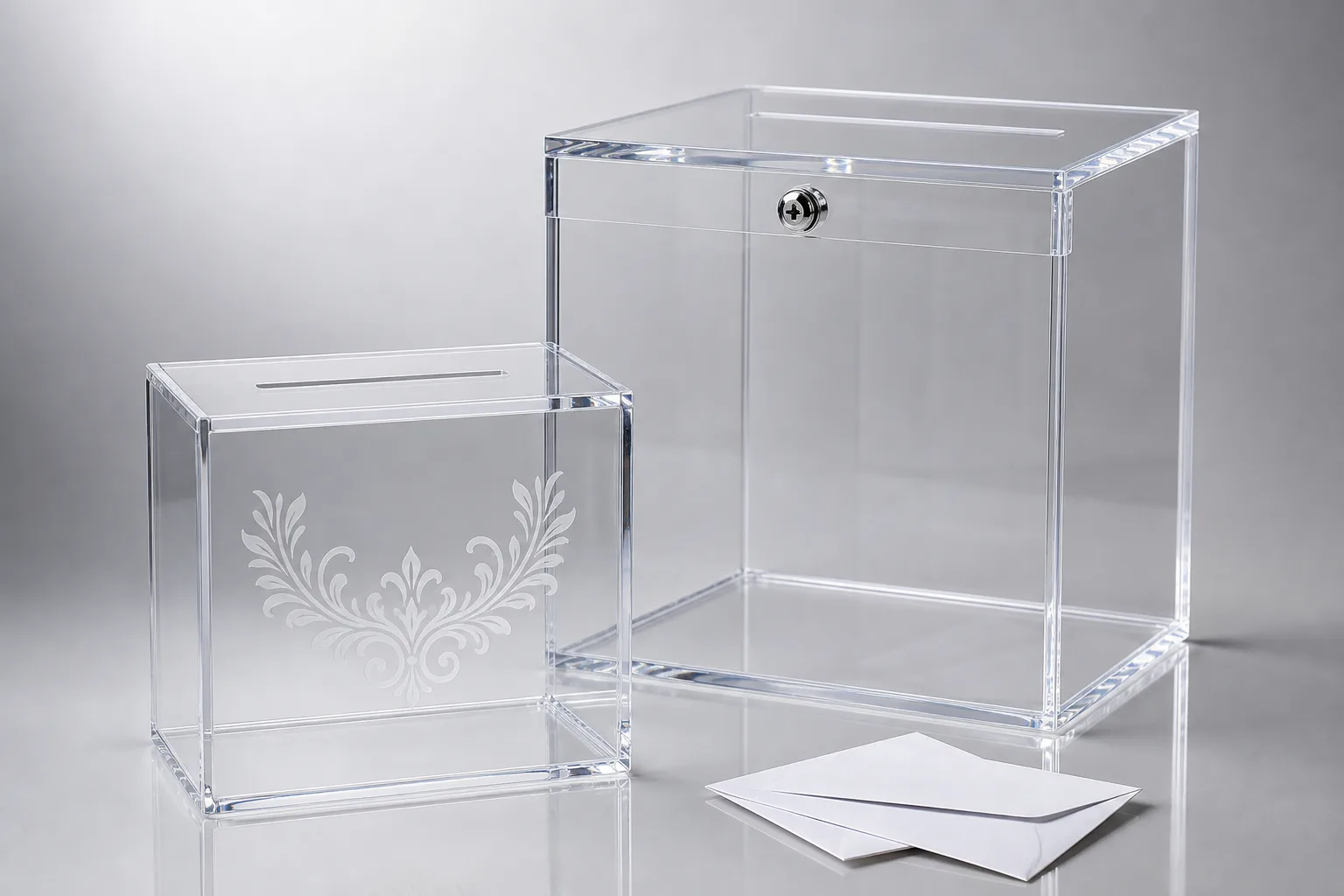 Personalized laser-engraved acrylic wedding card box beside a large-event tiered acrylic envelope box with a locked lid