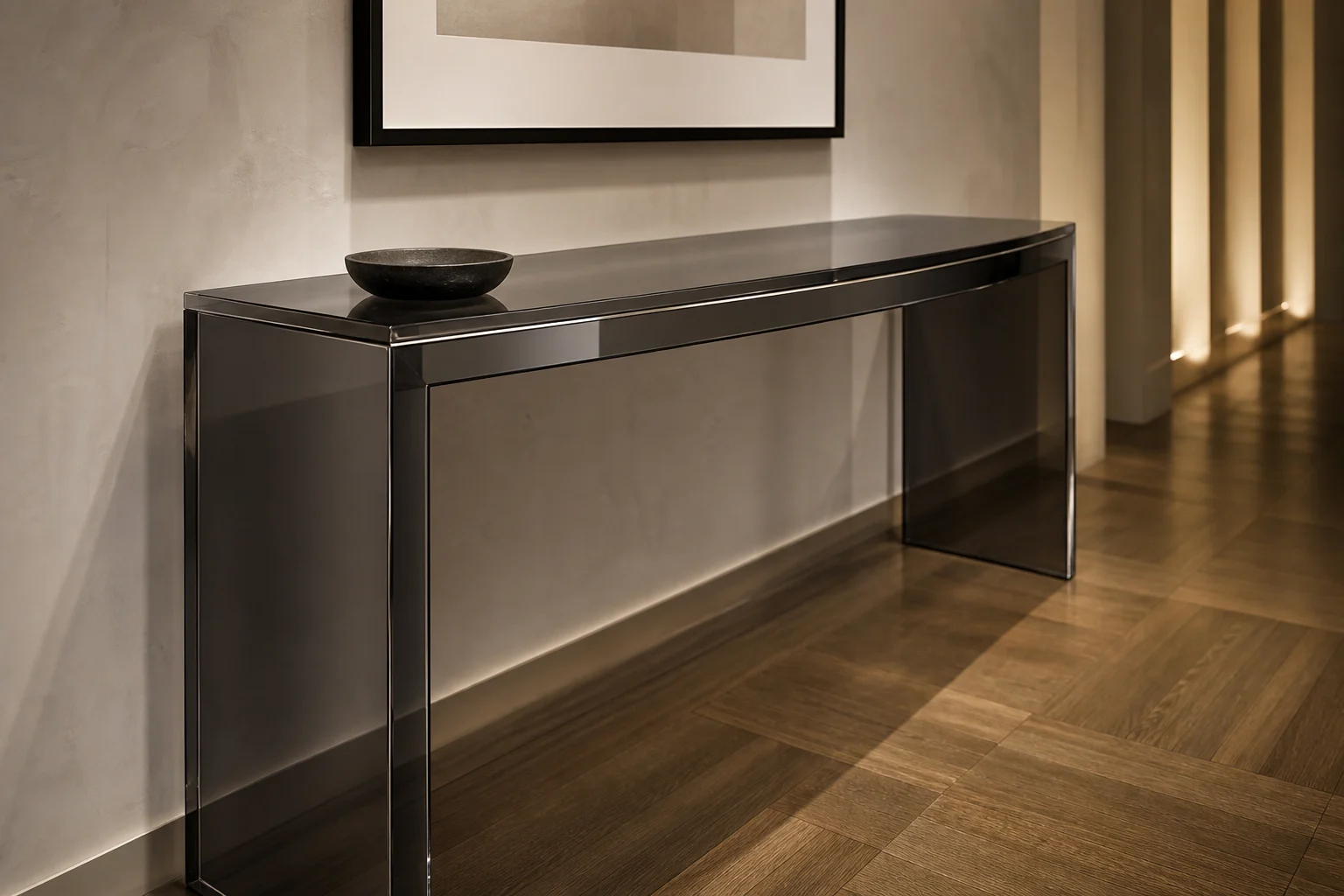 Clear cast acrylic console table with a gently curved bow front in a luxury hotel corridor