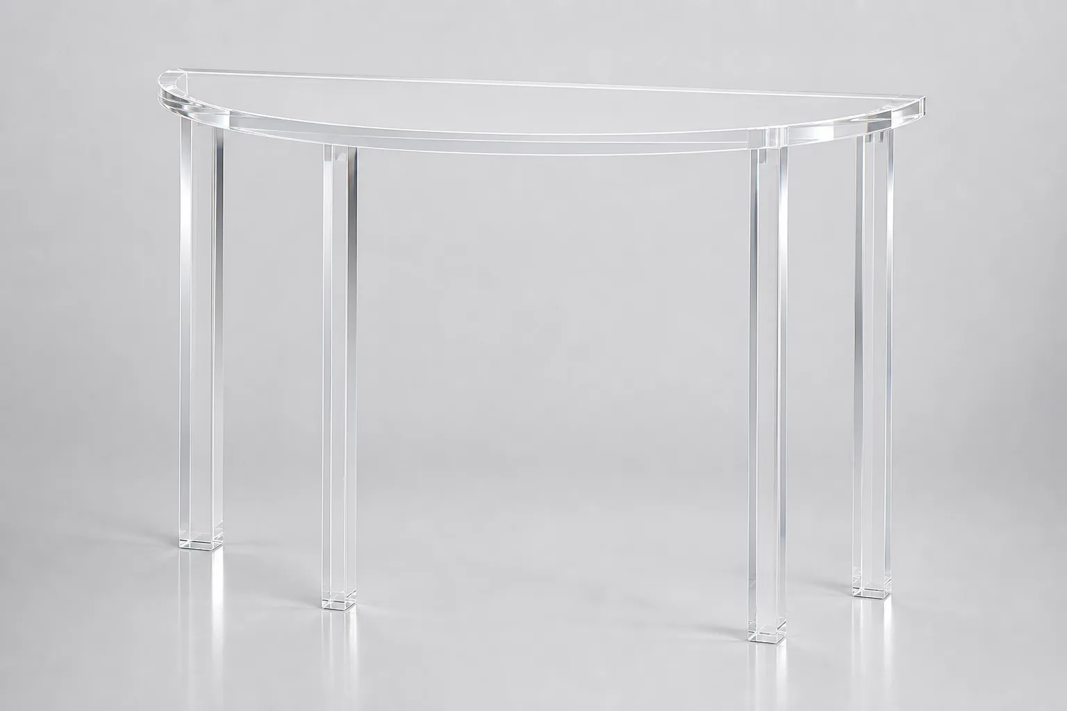 Clear cast acrylic demilune half-moon console table against a curved entry wall in a boutique hotel lobby