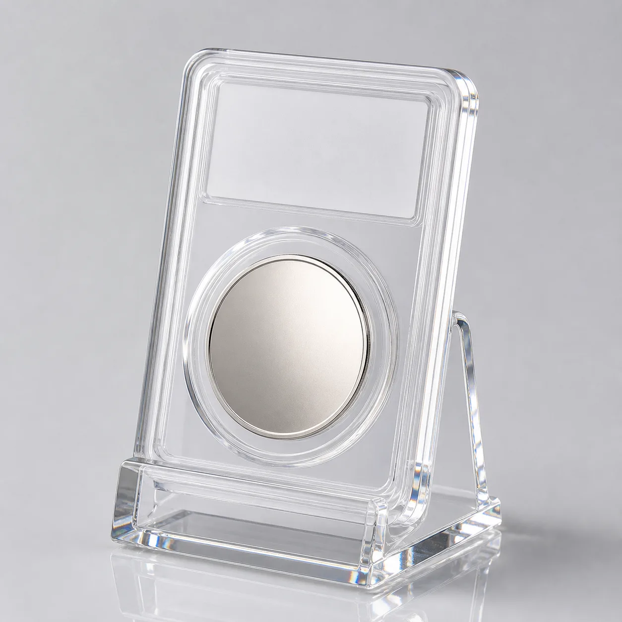 Clear acrylic single-coin display stand holding one graded-coin slab upright at a slight backward lean
