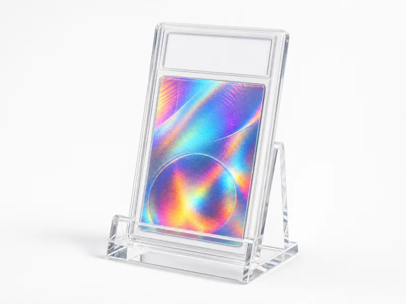 Clear acrylic single-slab desktop display stand holding one encapsulated graded card slab at a slight backward lean